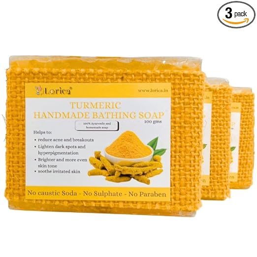 Woman holding Lorica Turmeric Handmade Bathing Soap, showcasing a natural herbal soap for glowing and healthy skin in a premium skincare setting.